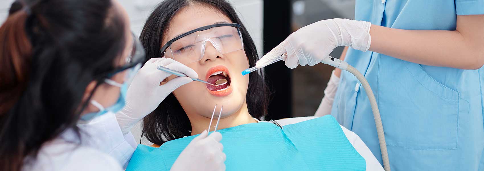 Dentist perform the dental treatments for her patient