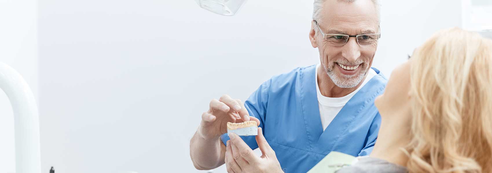 Dentist explaining gum therapy for his patient